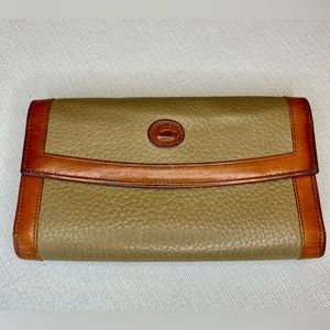 Vintage Dooney and Bourke pebble grain leather checkbook wallet.